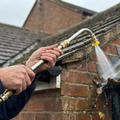 Telescopic pressure washer wand cleaning house gutters
