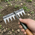 Carbon steel rake head being fitted to a handle over a flower bed